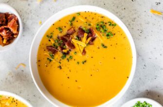 rich and creamy cheddar cheese soup made with carrots potatos and jalapeno for a spicy kick e1677593974564